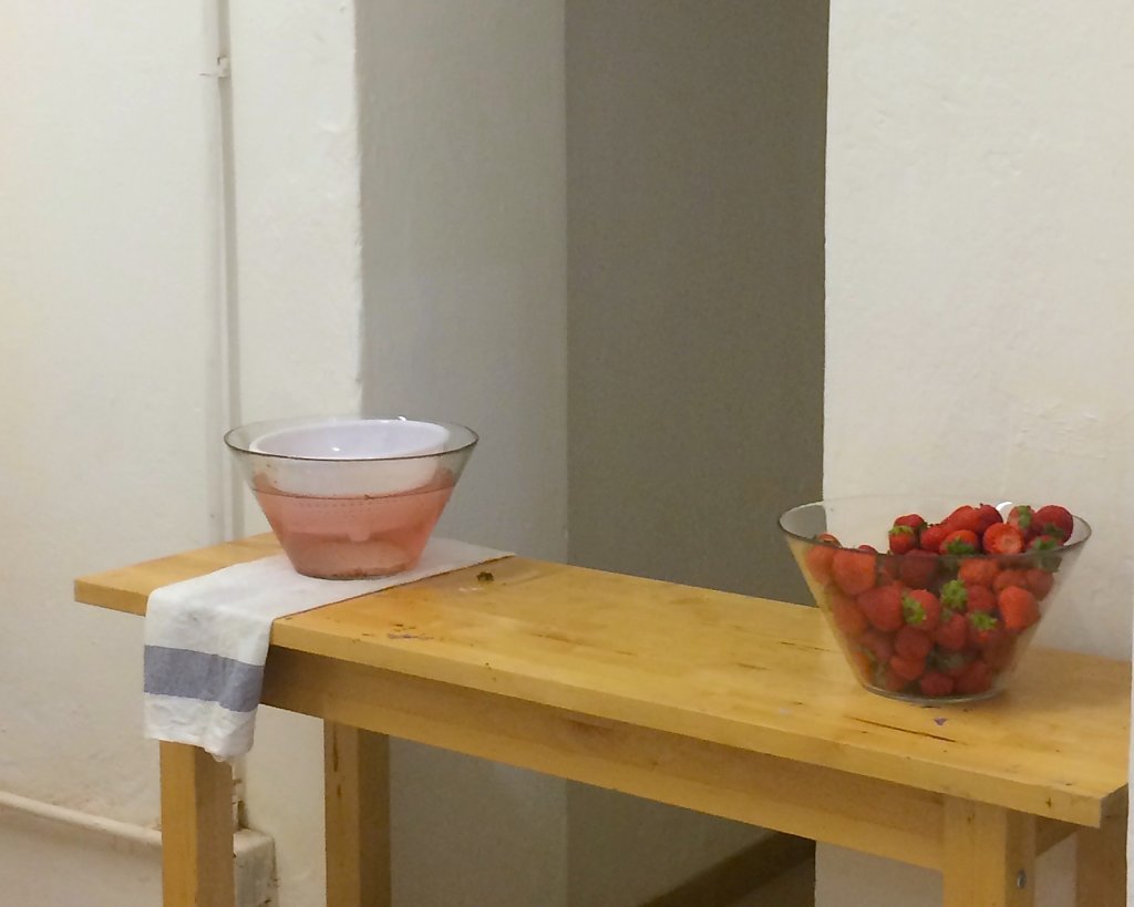 Fifty-eight pints of strawberries await baptism in water. 